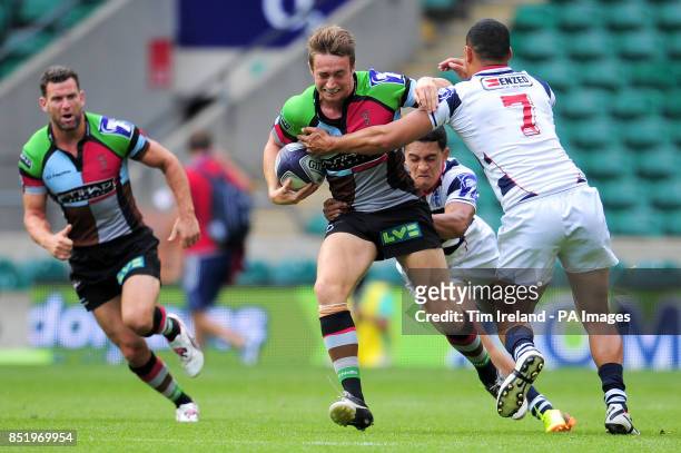 Harlequins' Miles Mantella is tackled in the semi final against Auckland during the World Club Sevens at Twickenham Stadium, London.
