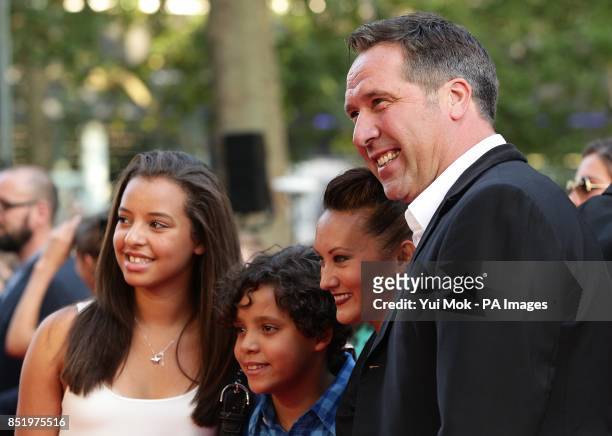 David Seaman Frankie Poultney and family arriving for the World Premiere of One Direction: This Is Us, at the Empire Leicester Square, London.