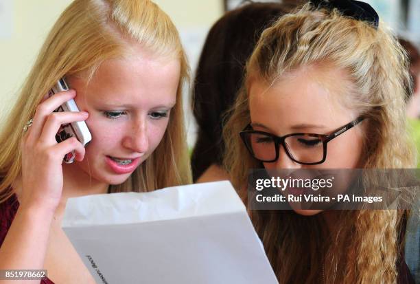 Amber Smith and Becky Robinson check their GCSE results at Colonel Frank Seely School, Calverton, Nottinghamshire.