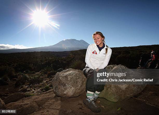 Mount Kilimanjaro rises in the background as Kimberley Walsh poses early in the morning on the second day of The BT Red Nose Climb of Kilimanjaro on...