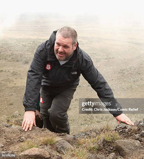 Chris Moyles treks up a steep section of mountain on the second day of The BT Red Nose Climb of Kilimanjaro on March 3, 2009 in Arusha, Tanzania....