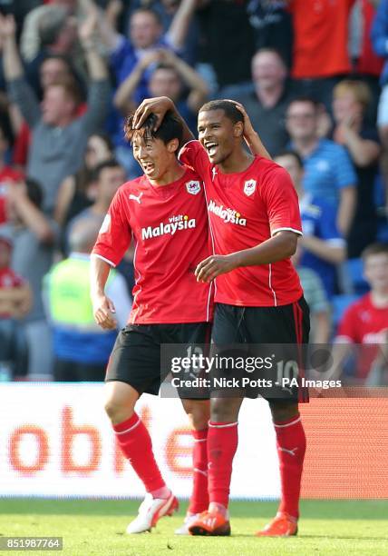 Cardiff City's Fraizer Campbell celebrates scoring his side's third goal of the game with teammate Bo-Kyung Kim