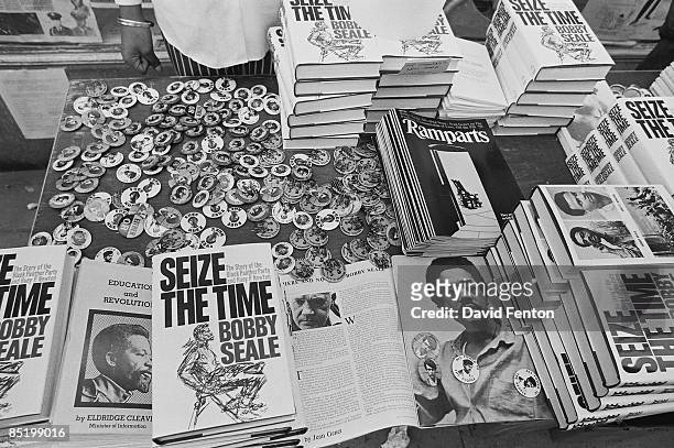 Close-up view of a sales table full of Black Panther Party related literature and buttons, New Haven, Connecticut, May 1 or 2, 1970. Visible are...