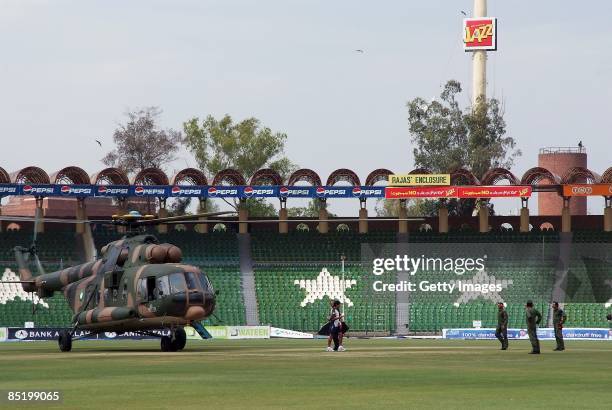 Member of the Sri Lankan international cricket team prepares to board a rescue helicopter as air crew look on at the Gadaffi Stadium on March 3, 2009...