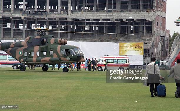 Members of the Sri Lankan international cricket team board a rescue helicopter at the Gadaffi Stadium on March 3, 2009 in Lahore, Pakistan. The team...