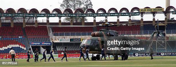 Members of the Sri Lankan international cricket team board a rescue helicopter at the Gadaffi Stadium on March 3, 2009 in Lahore, Pakistan. The team...