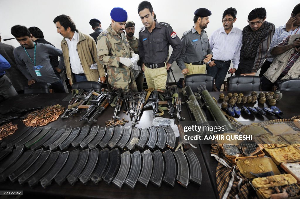 Pakistani securuty officials display the