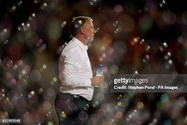 Cheltenham Town's Manager Mark Yates stands on the touchline dejected after his side concede a goal during the Capital One Cup, Second Round match at...