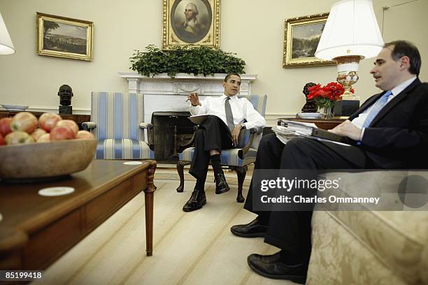 President Barack Obama works with Jon Favreau, Ben Rhodes and David Axelrod on his address to the Joint Session of Congress in the Oval office of the...