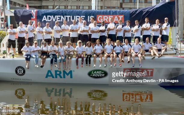 Sir Robin Knox-Johnston and England's Ollie Phillips pose with crew and members of the Rugby 7s team in St Katharine Docks, London.