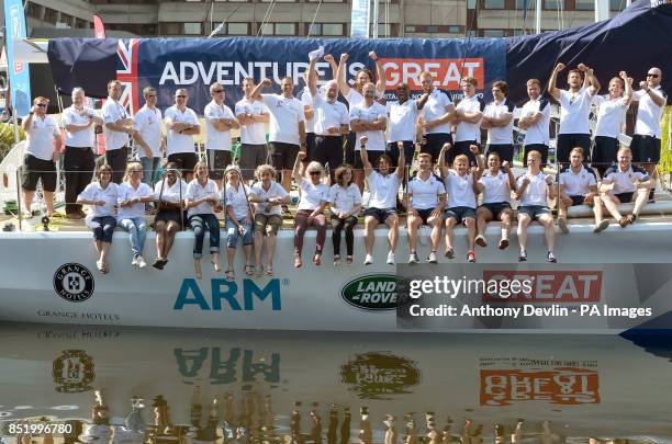 Sir Robin Knox-Johnston and England's Ollie Phillips pose with crew and members of the Rugby 7s team in St Katharine Docks, London.