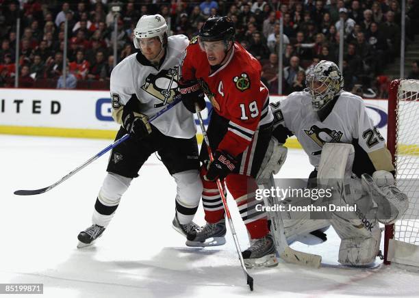 Jonathan Toews of the Chicago Blackhawks waits for a pass between Kris Letang and Marc-Andre Fleury of the Pittsburgh Penguins on February 27, 2009...