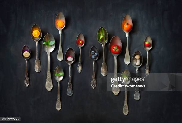 flat lay colourful vegan food slice in antique metal spoon still life. - smaka bildbanksfoton och bilder