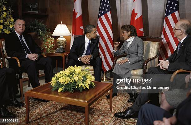 President Barack Obama speaks with Governor General of Canada Michaelle Jean upon his arrival at the Ottawa International Airport on February 19,...