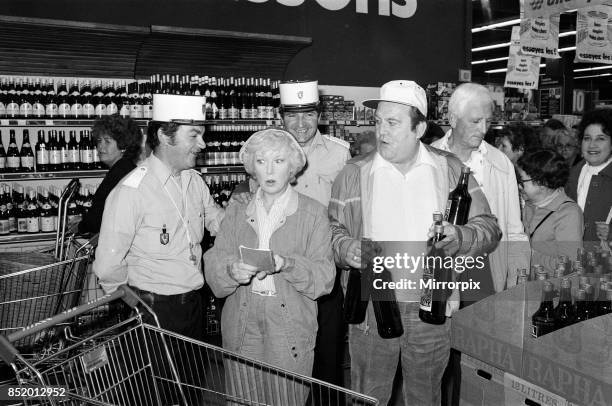 Filming of a series of 'Terry and June', where they go on a day trip to Boulogne, they are pictured in a supermarket, actress June Whitfield plays...