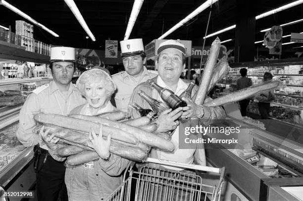 Filming of a series of 'Terry and June', where they go on a day trip to Boulogne, they are pictured in a supermarket, actress June Whitfield plays...