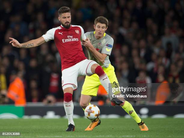 Olivier Giroud of Arsenal and Dominique Heintz of FC Cologne during the UEFA Europa League match between Arsenal FC and FC Cologne at Arsenal Stadium...