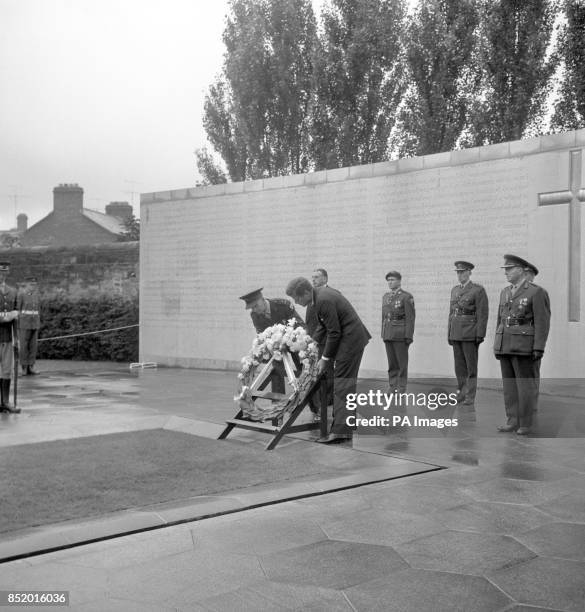 President JOHN F. KENNEDY placing a wreath when he visited the graves of the executed leaders of Ireland's Easter Rising of 1916 at Arbour Hill third...