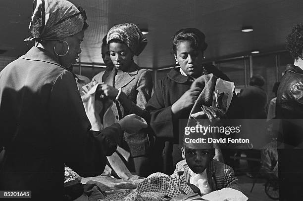 Young boy stares at the camera while members of the Black Panther Party distribute free clothing to the public, New Haven, Connecticut, September 28,...