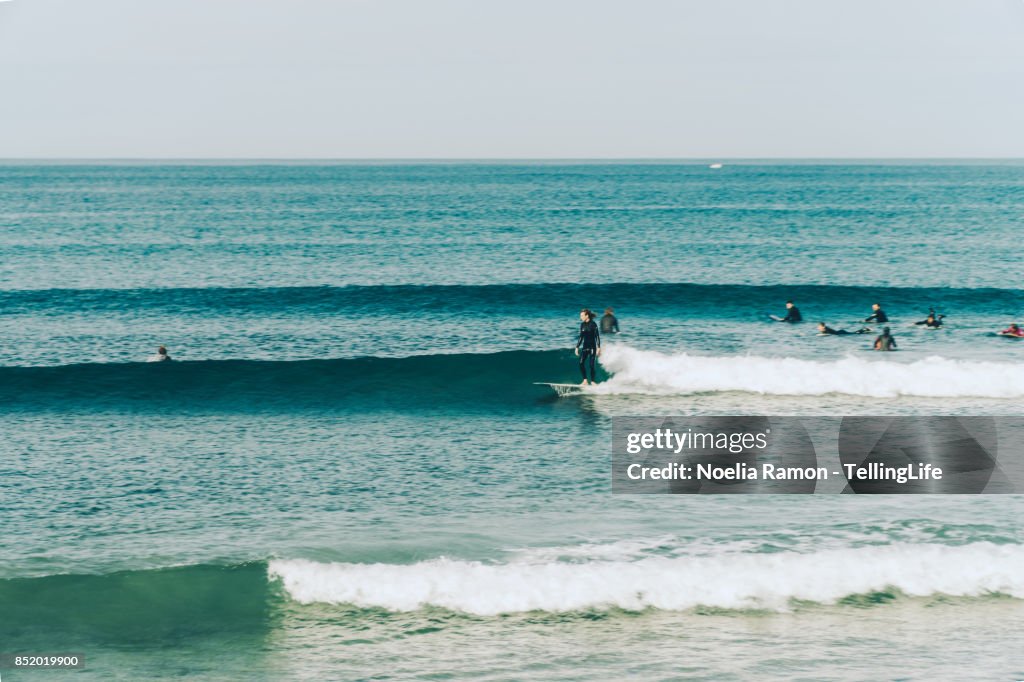 Beach Wave Riding Rafts Surfers On The Ocean Riding Waves High-Res Stock Photo - Getty Images