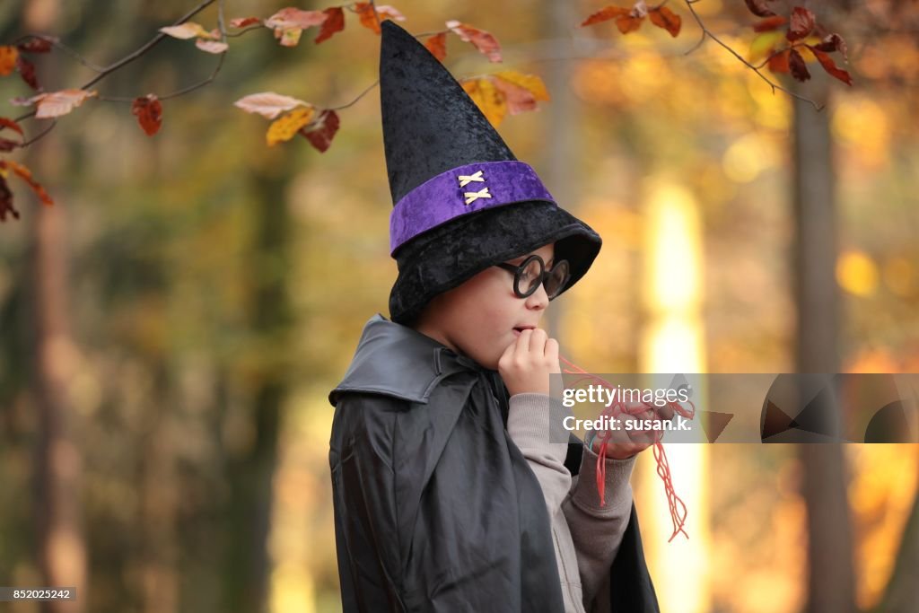 Wizard eating red worms in the woods.