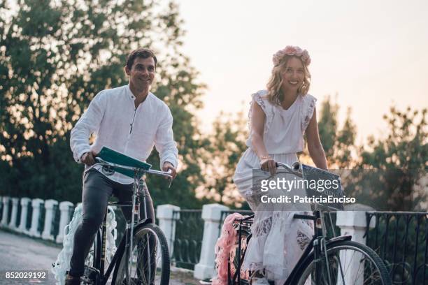 just married couple in bikes - flower crown stock pictures, royalty-free photos & images