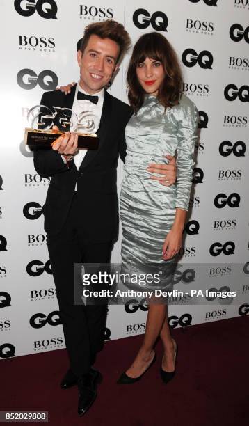 Nick Grimshaw, winner of Radio Personality, poses with Alexa Cheung backstage at the GQ Men of the Year Awards in association with Hugo Boss at the...
