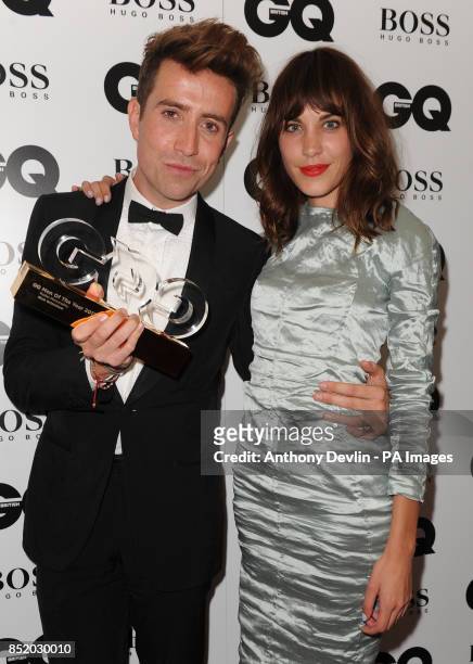 Nick Grimshaw, winner of Radio Personality, poses with Alexa Cheung backstage at the GQ Men of the Year Awards in association with Hugo Boss at the...