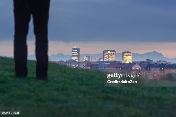 urban skyline with modern office buildings and zugspitze mountain in the background, munich, bavaria, germany, europe - silhouette münchen stock pictures, royalty-free photos & images
