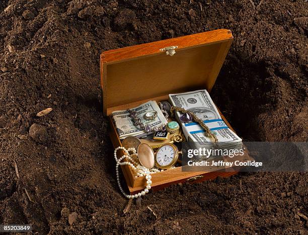 buried box with money and jewels - hiding money stock pictures, royalty-free photos & images