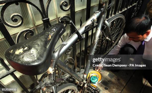 Saddle of bicycle appears melted as sun reflects off 20 Fenchurch Street, known as the Walkie Talkie, onto Eastcheap Street in the City of London.