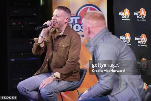 Ben Haggerty aka Macklemore gives an interview to on air personality Eric Powers at Hot 103.7 as his new solo album "Gemini" is released on September...