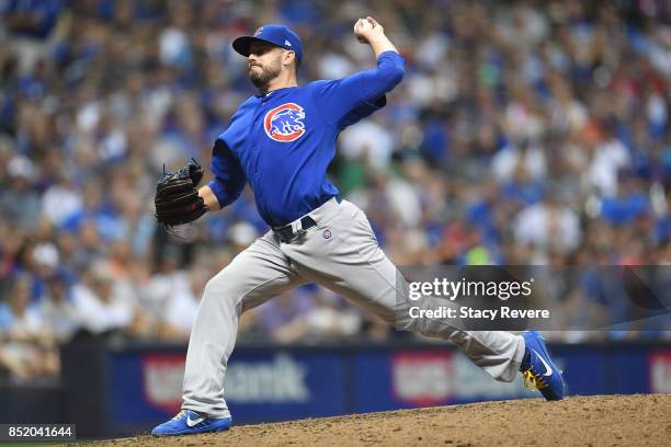 Brian Duensing of the Chicago Cubs throws a pitch during the sixth inning of a game against the Milwaukee Brewers at Miller Park on September 22,...