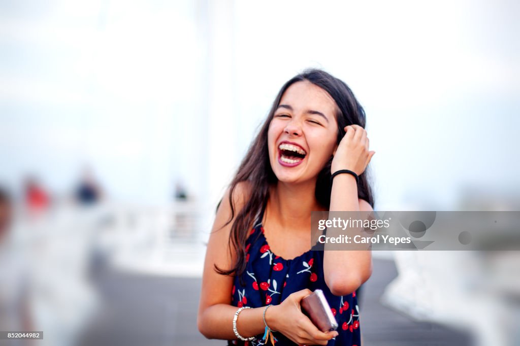 Beautiful brunette teenanger laughing