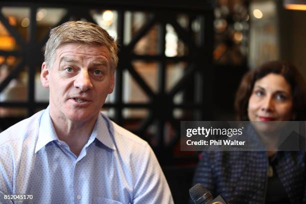 Prime Minister Bill English speaks to the media alongside his wife Mary English at the Pullman Hotel on September 23, 2017 in Auckland, New Zealand....