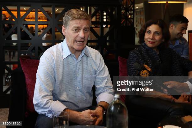 Prime Minister Bill English speaks to the media alongside his wife Mary English at the Pullman Hotel on September 23, 2017 in Auckland, New Zealand....