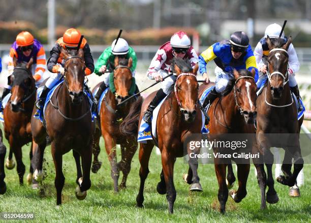 John Allen riding Cliff's Edge defeats Dwayne Dunn riding Sunquest in Race 2 during Melbourne Racing at Caulfield Racecourse on September 23, 2017 in...