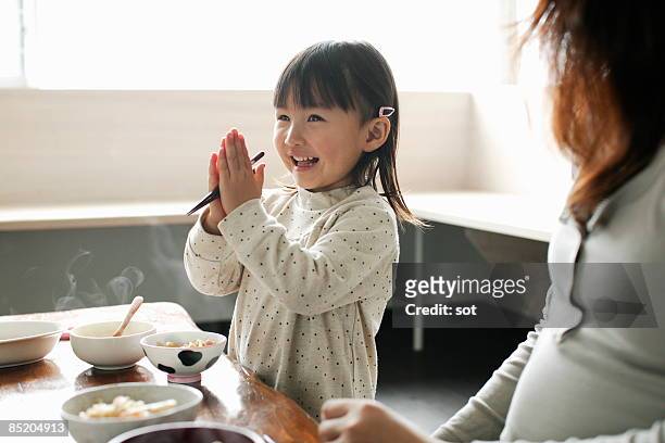 little girl eating meal,smiling - tipo di cibo foto e immagini stock