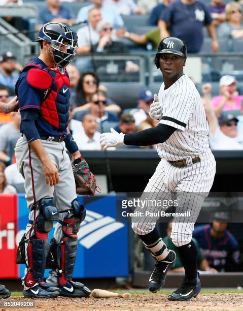 Didi Gregorius of the New York Yankees hit his 25th home run of the season and helped catcher Jason Castro of the Minnesota Twins who he hit with his...