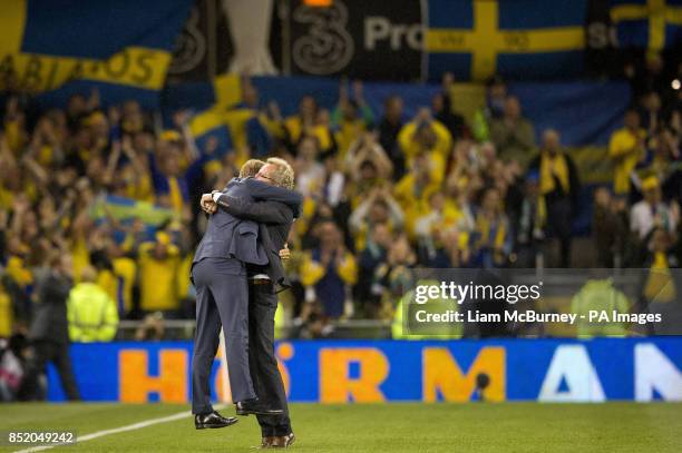 Sweden's manager Erik Hamren embraces his assistant coach Marcus Allback after winning the World Cup Qualifying, Group C match at the Aviva Stadium,...
