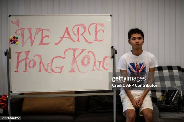 In this photo taken on September 20 Thomas Lee, secretary at the CUHK student union, poses in front of a whiteboard kept in the student union offices...