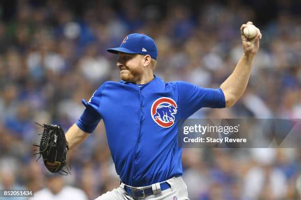 Brian Duensing of the Chicago Cubs throws a pitch during the ninth inning of a game against the Milwaukee Brewers at Miller Park on September 22,...