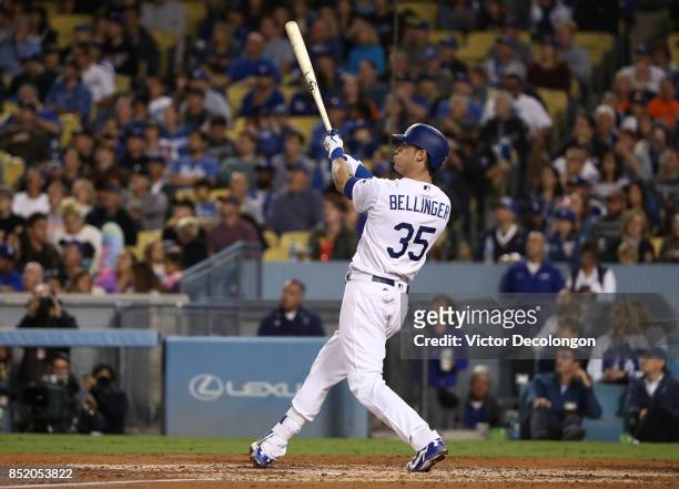 Cody Bellinger of the Los Angeles Dodgers watches the ball leave the ball park for his three-run home run, his 39th of the season to break the...