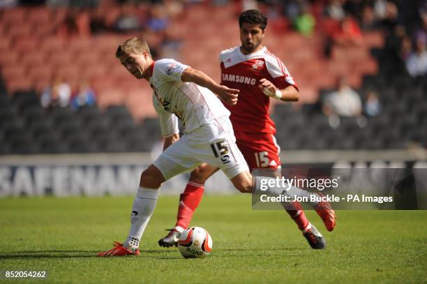 Milton Keynes Dons' Patrick Bamford and Swindon Town's Yaser Kasim during the Sky Bet Football League One match at Stadium:MK, Milton Keynes.