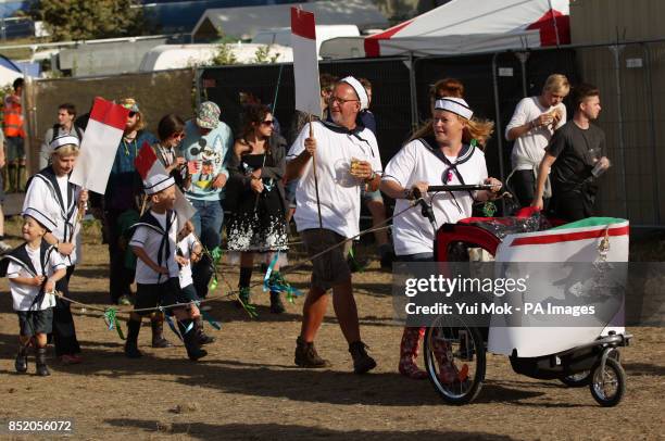 Family of festival goers Lucy and Guy Charlesworth with their children Harry, aged 7, and twins Jack and George, aged 5, and nanny Jenny Torrance in...