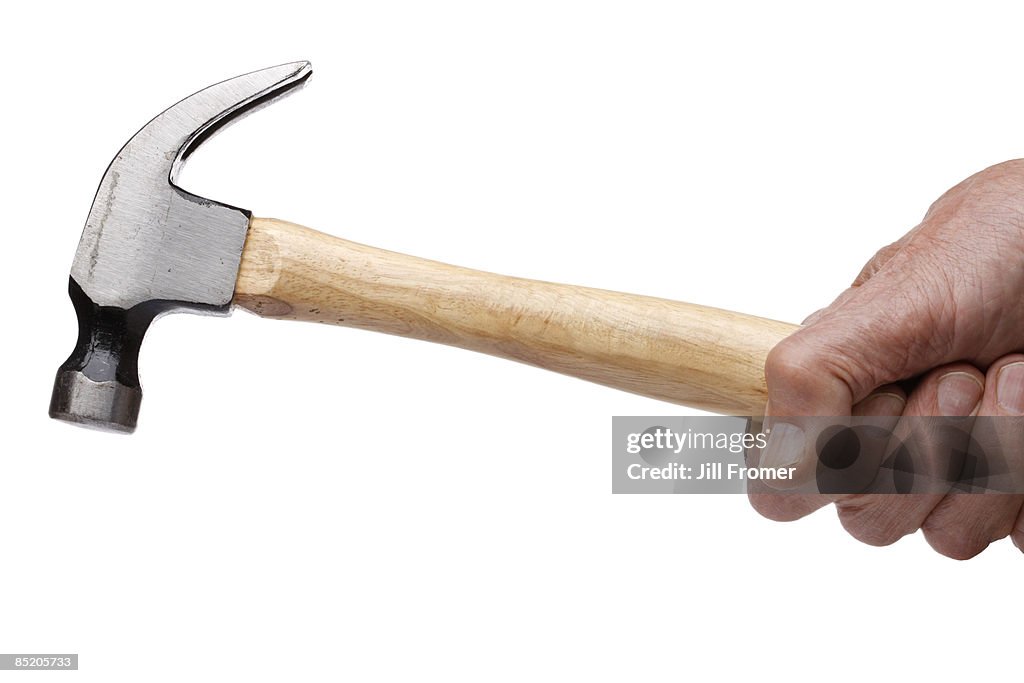 Man Swinging a Hammer