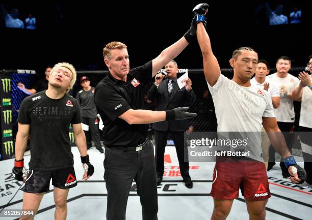 Dong Hyun Kim of South Korea celebrates his knockout victory over Takanori Gomi of Japan in their lightweight bout during the UFC Fight Night event...