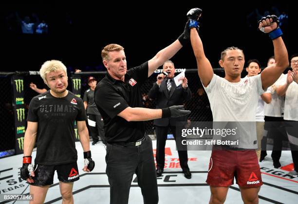 Dong Hyun Kim of South Korea celebrates his knockout victory over Takanori Gomi of Japan in their lightweight bout during the UFC Fight Night event...