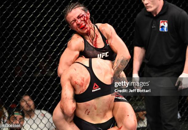 Claudia Gadelha of Brazil attempts to submit Jessica Andrade of Brazil in their women's strawweight bout during the UFC Fight Night event inside the...