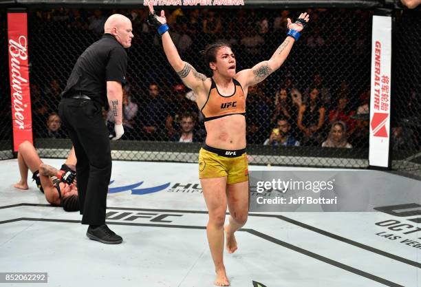 Jessica Andrade of Brazil yells after facing Claudia Gadelha of Brazil in their women's strawweight bout during the UFC Fight Night event inside the...